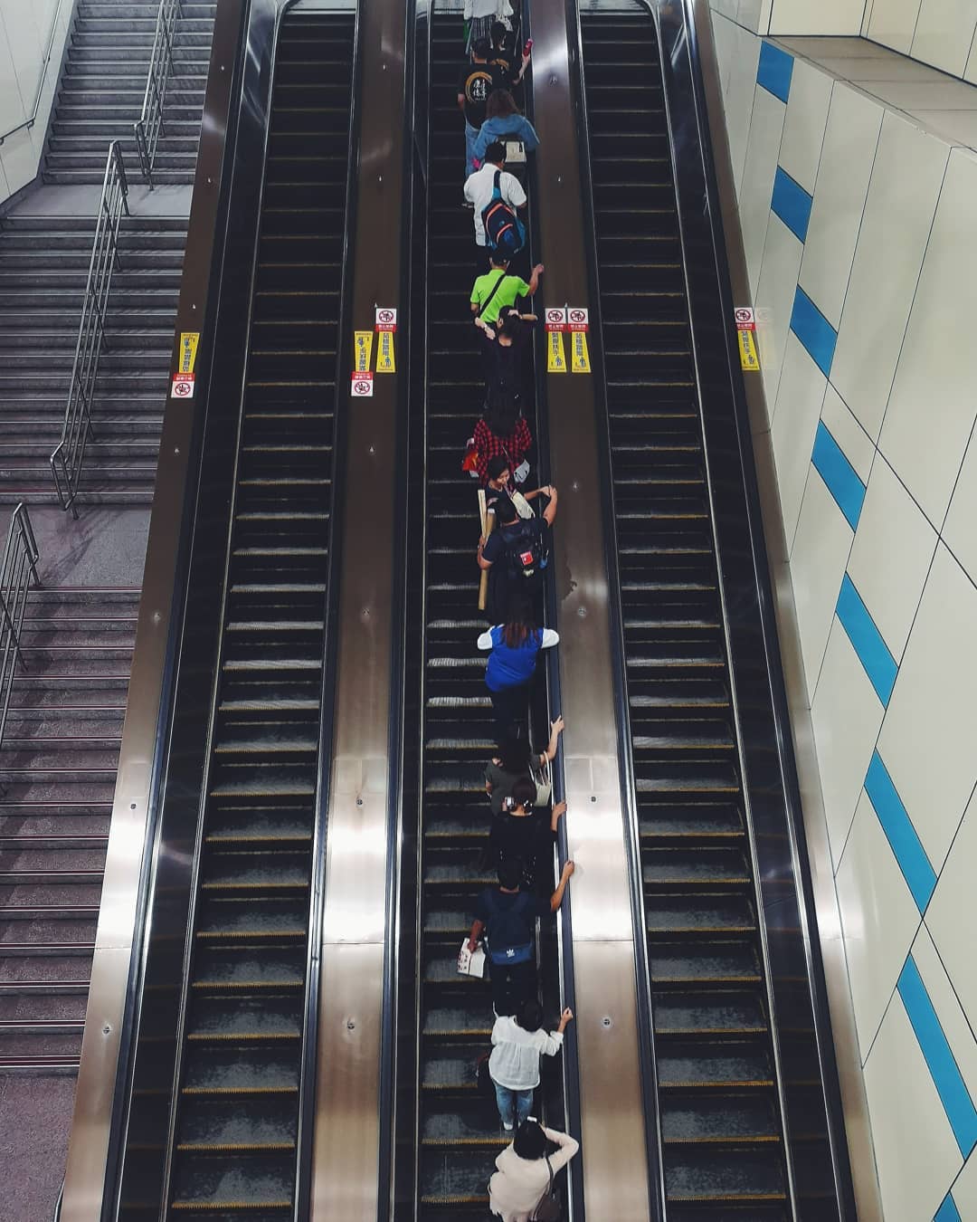 Passengers are taking the elevator to the MRT station