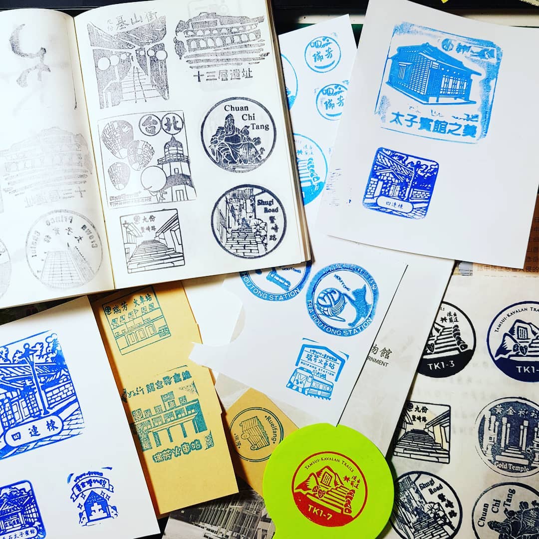 A collection of travel stamp prints from Taiwan tourist attractions and railway stations