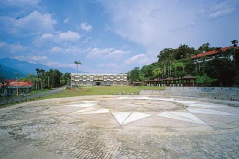 Open plaza with a geometric stone design in the foreground