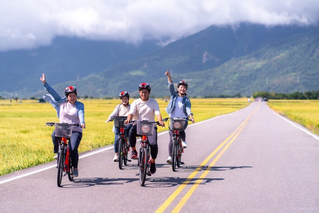 people riding bicycles along Mr. Brown Avenue in Chishang Township