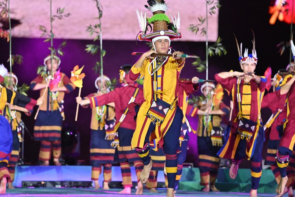 vibrant cultural dance performance showcasing traditional Austronesian indigenous attire
