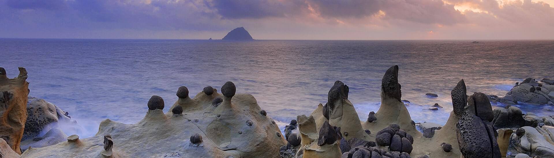Coastal ocean cliffs meeting deep blue waves along a scenic coastline.