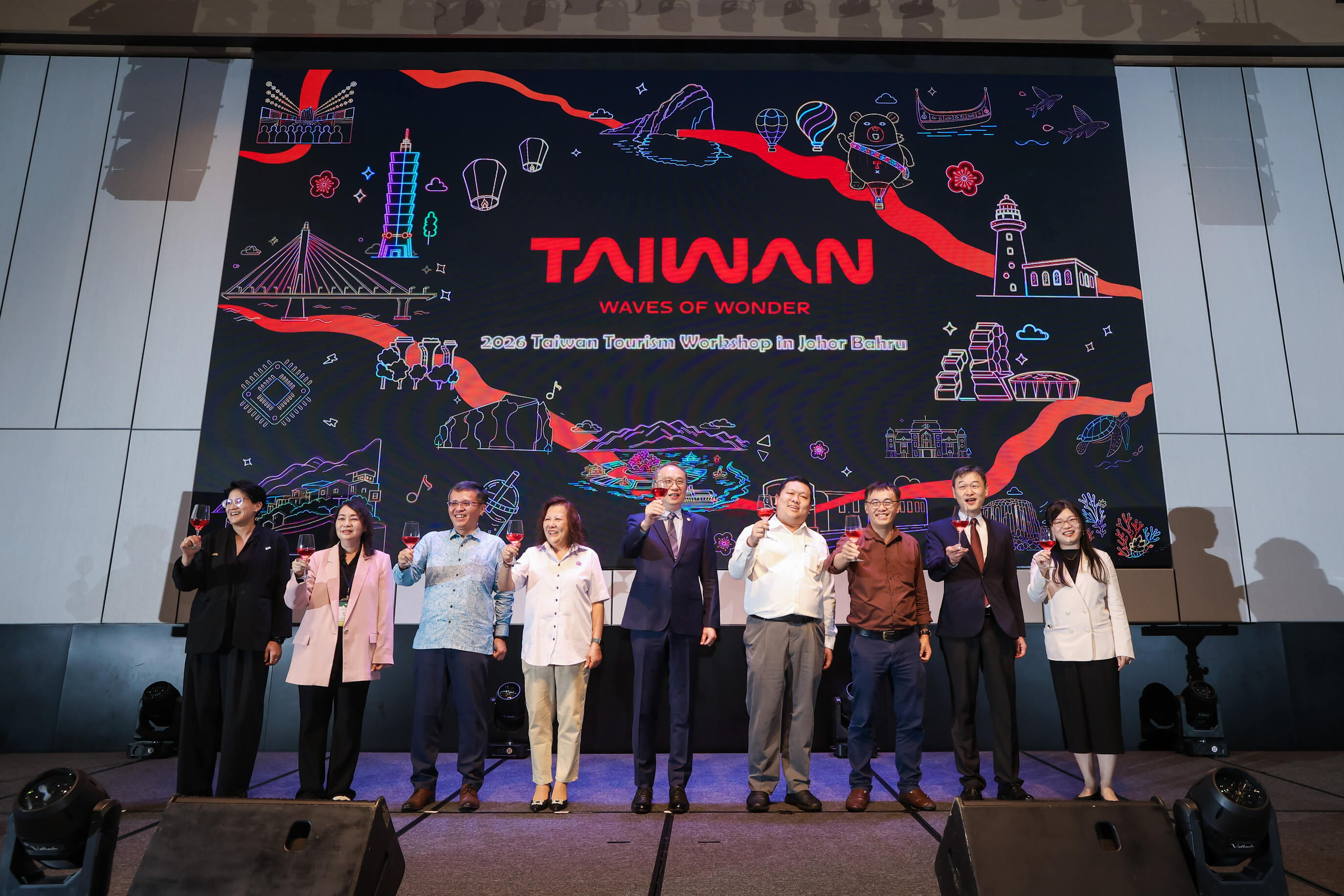 Taiwan Tourism delegation representatives posing on stage during the MATTA Fair event.